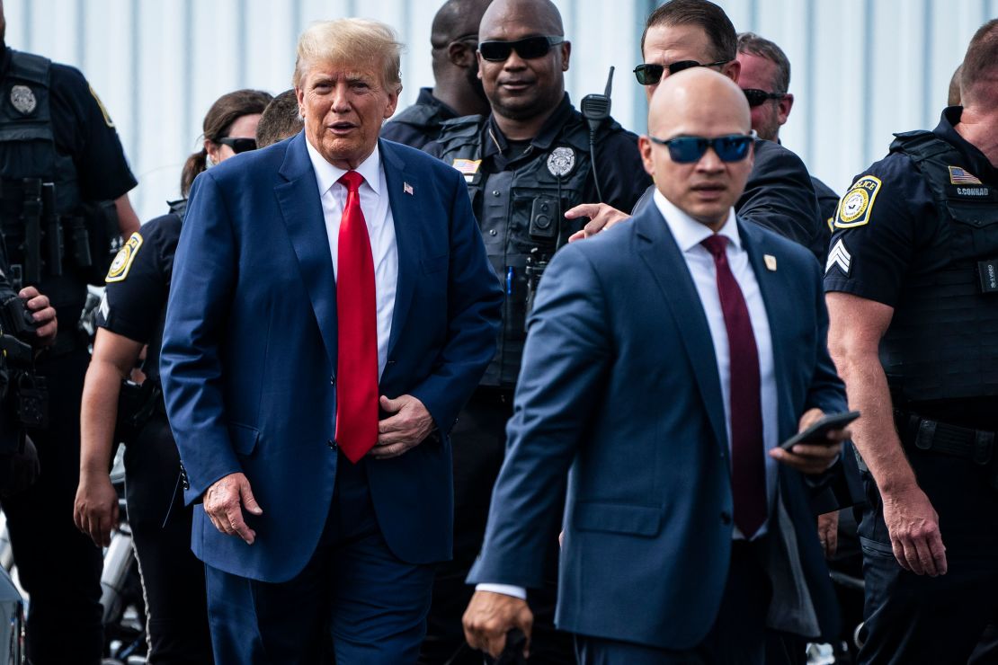 Donald Trump and his aid Walt Nauta arrive at an airport after Trump spoke at the Georgia Republican Party's state convention on Saturday, June 10, 2023 in Columbus, Georgia.