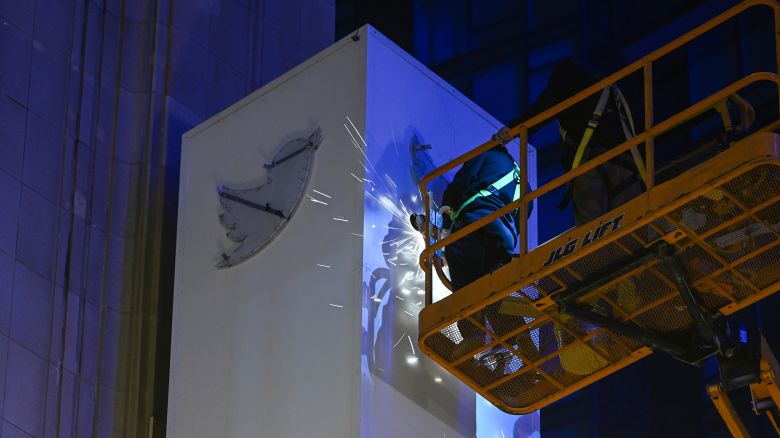 Workers take blue bird and the letters off from Twitter sign as the ''X'' sign was installed on the top of Twitter's headquarters in San Francisco, California, on July 29, 2023.