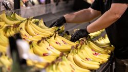 An employee arranges bananas at an Amazon Fresh grocery store in Schaumburg, Illinois, US, on Monday, July 24, 2023. Amazon.com Inc. is launching the biggest overhaul of its grocery business since it acquired Whole Foods Market six years agorevamping stores, testing new highly automated warehouses and, for the first time, offering fresh-food delivery to customers who aren't Prime subscribers.