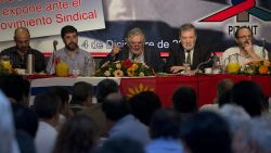 Uruguayan President Jose Mujica (C) speaks accompanied by his ministers of Industry, Energy and Mines, Roberto Kreimerman (2nd- R), Social Development, Daniel Olesker (R) and Uruguayan PIT-CNT (Union Federation) coordinators Marcelo Abdala (L) and Fernando Pereira (2nd-L)  during a working breakfast at the headquarters of the  PIT-CNT Uruguayan labor union federation in Montevideo on December 4, 2012. AFP PHOTO/Pablo PORCIUNCULA        (Photo credit should read PABLO PORCIUNCULA/AFP via Getty Images)