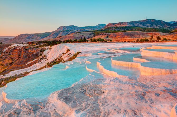 <strong>Cloud castle:</strong> Formed from natural calcites left behind by geothermal waters, the Travertine slopes at Pamukkale in southwestern Turkey are a dazzling tourist attraction