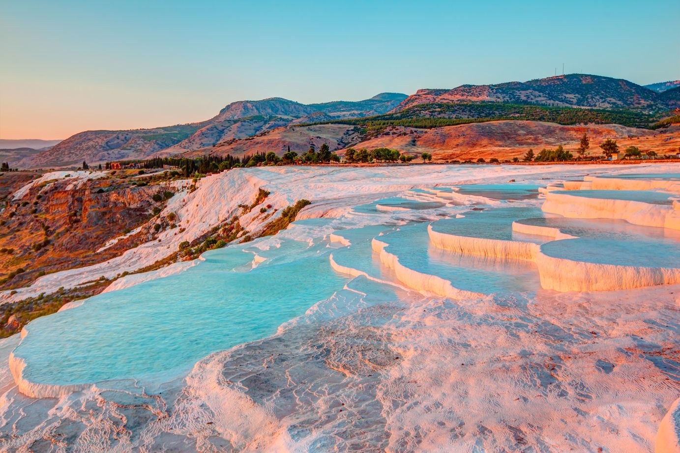 <strong>Cloud castle:</strong> Formed from natural calcites left behind by geothermal waters, the travertine slopes at Pamukkale in southwestern Turkey are a dazzling tourist attraction.