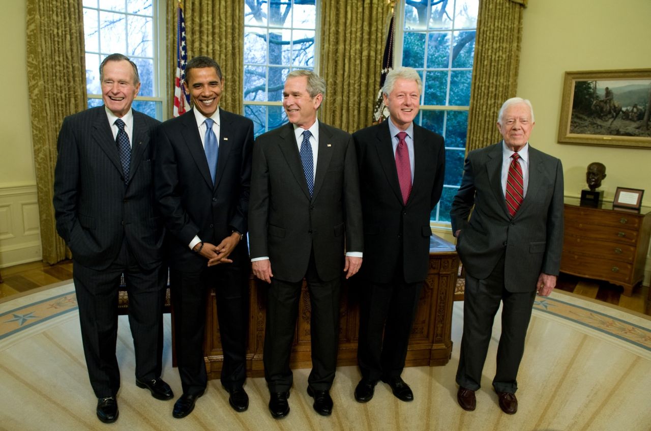 Former President Jimmy Carter, right, stands with, from left, former President George H.W. Bush, then-President-elect Barack Obama, former President George W. Bush and former President Bill Clinton in the Oval Office of the White House in Washington, DC, on January 7, 2009.