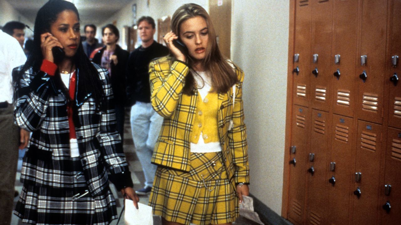 Stacey Dash and Alicia Silverstone walking and talking on their mobile phones in a scene from the film 'Clueless', 1995. (Photo by Paramount Pictures/Getty Images)