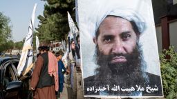 A poster of Taliban Supreme Leader Hibatullah Akhundzada is seen along a road in Kabul on August 14, 2023.