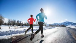 Two women jogging in Sun Valley on a beautiful winter day.