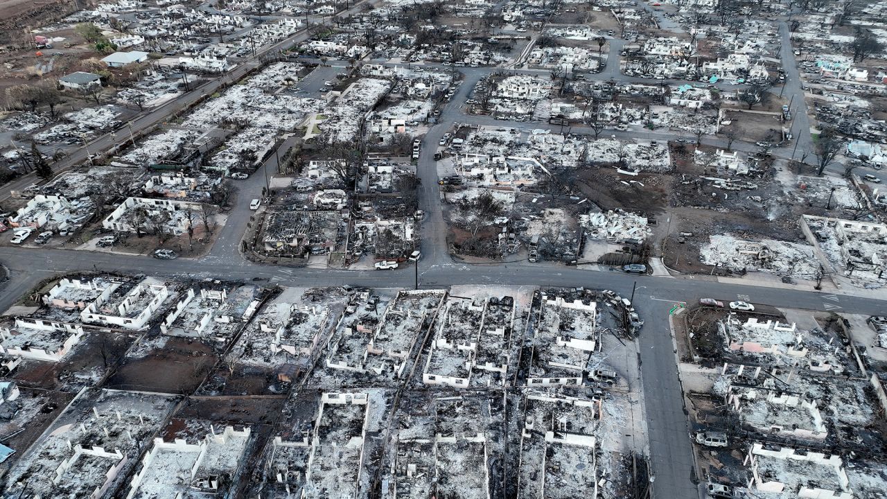 LAHAINA, HAWAII - AUGUST 18: In an aerial view, burned cars and homes are seen in a neighborhood that was destroyed by a wildfire on August 18, 2023 in Lahaina, Hawaii. At least 111 people were killed and thousands were displaced after a wind driven wildfire devastated the towns of Lahaina and Kula early last week. Crews are continuing to search for missing people. (Photo by Justin Sullivan/Getty Images)