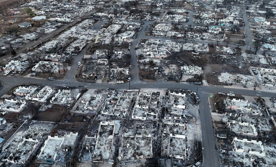 Burned cars and homes are seen in a neighborhood that was destroyed by a wildfire on August 18, 2023 in Lahaina, Hawaii. The fire burned rapidly through invasive grass.