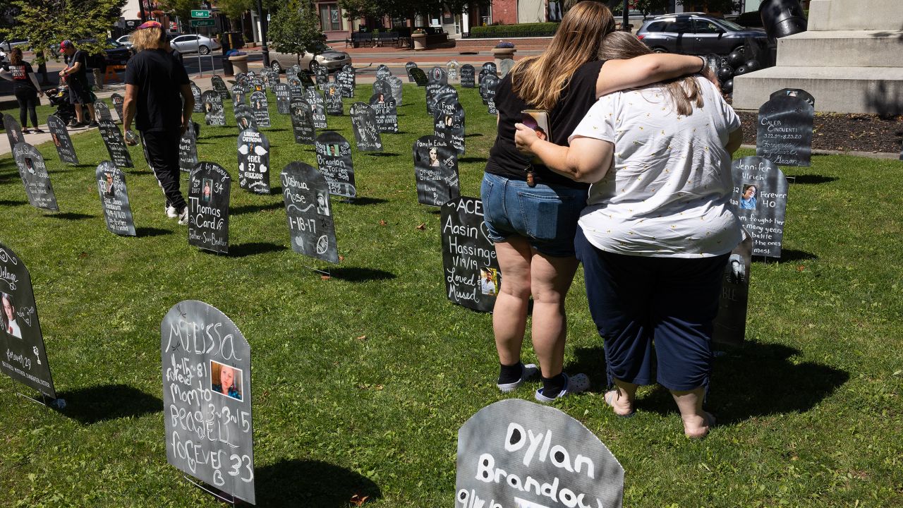BINGHAMTON, NEW YORK - AUGUST 19: Friends and family members of people who have died from overdoses in Broome County gather for an annual memorial, August 19, 2023, in downtown Binghamton, New York. 277 names were represented with replica tombstones downtown to bring awareness to the struggles of addiction and the dangers of fentanyl and other powerful opioids. (Photo by Andrew Lichtenstein/Corbis via Getty Images)