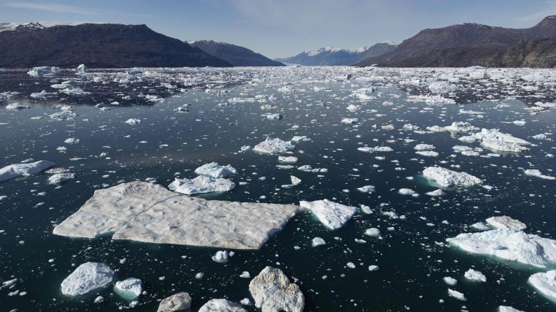 This photograph taken on August 16, 2023, shows different sizes of icebergs drifting as they melt due to warm temperaturesalong along the Scoresby Sound Fjord, in Eastern Greenland. The French National Centre for Scientific Research is undertaking an expedition to explore Greenland's isolated fjords, the planet's largest fjord system, which remains vastly understudied. The expedition, arranged by the volunteer-run French initiative Greenlandia, is dedicated to understanding the climate change's effects on Scoresby Fjord and its inhabitants. (Photo by Olivier MORIN / AFP) (Photo by OLIVIER MORIN/AFP via Getty Images)