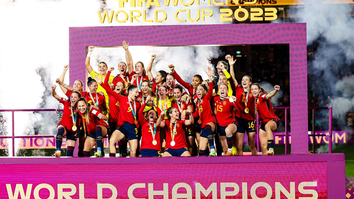 Spain's World Cup-winning squad celebrates with the trophy after winning the 2023 edition of the tournament.