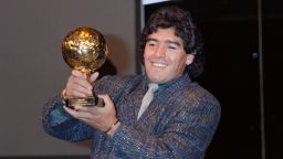 Diego Maradona poses with the Ballon d'Or at the Lido in Paris on November 13, 1986. He was awarded following the 1986 FIFA World Cup. The Golden Ball award is presented to the best player at each FIFA World Cup finals. (Photo by Pascal GEORGE / AFP) (Photo by PASCAL GEORGE/AFP via Getty Images)