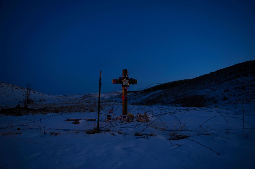 Snow covers the ground at a memorial where the body of Jessica Ridgeway was found in west Arvada, March 13, 2013.