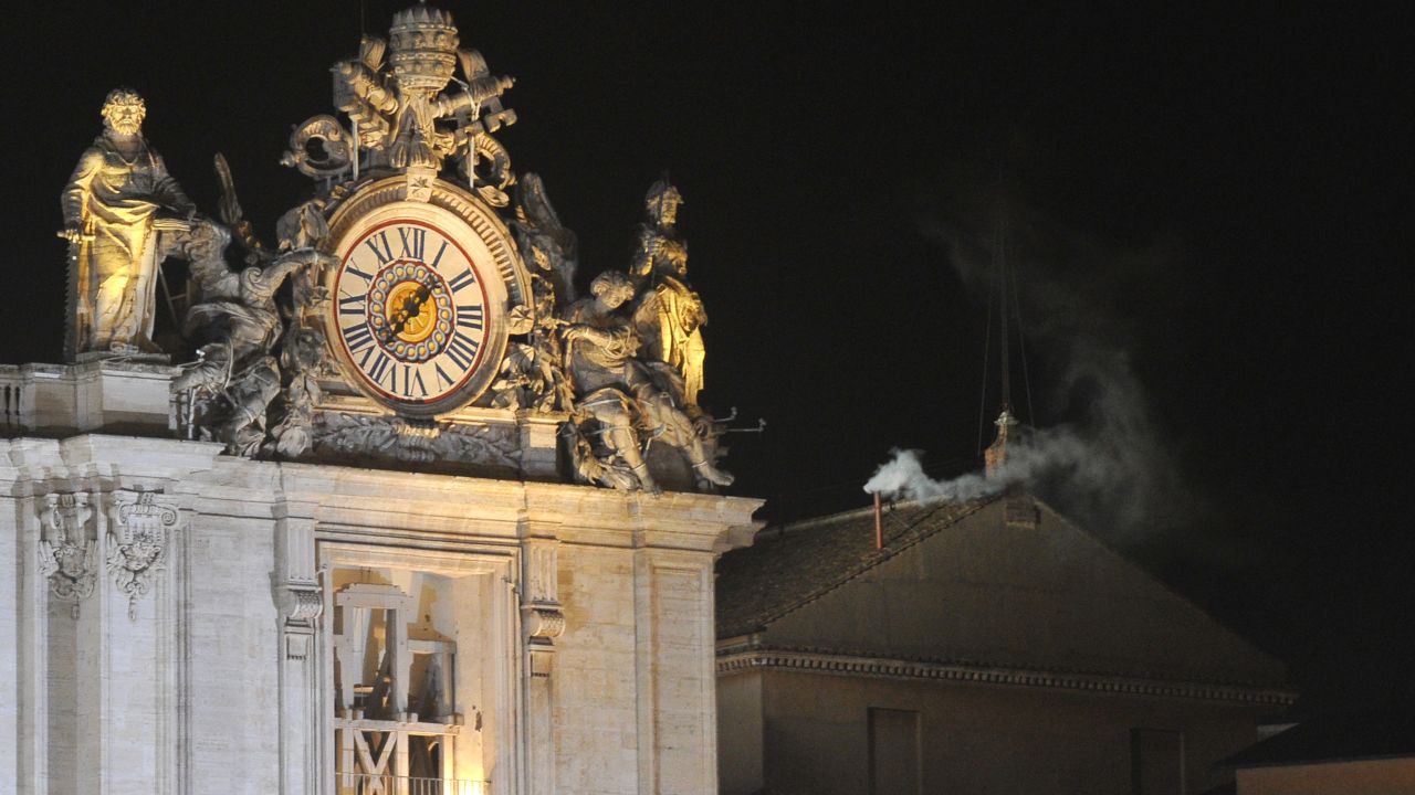 White smoke rises from the chimney on the roof of the Sistine Chapel meaning that cardinals elected a new pope during the conclave on  March 13, 2013 at the Vatican.  AFP PHOTO / TIZIANA FABI        (Photo credit should read TIZIANA FABI/AFP via Getty Images)