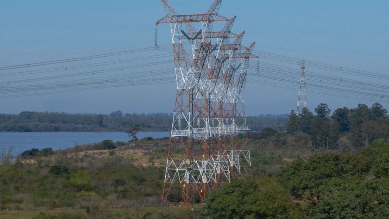 High voltage pylons located in Concordia, in the Argentine province of Entre Rios, are seen near the Salto Grande binational hydroelectric dam on the Uruguay River between Salto in Uruguay and Concordia in Argentina, on August 30, 2023. (Photo by Pablo PORCIUNCULA / AFP) (Photo by PABLO PORCIUNCULA/AFP via Getty Images)