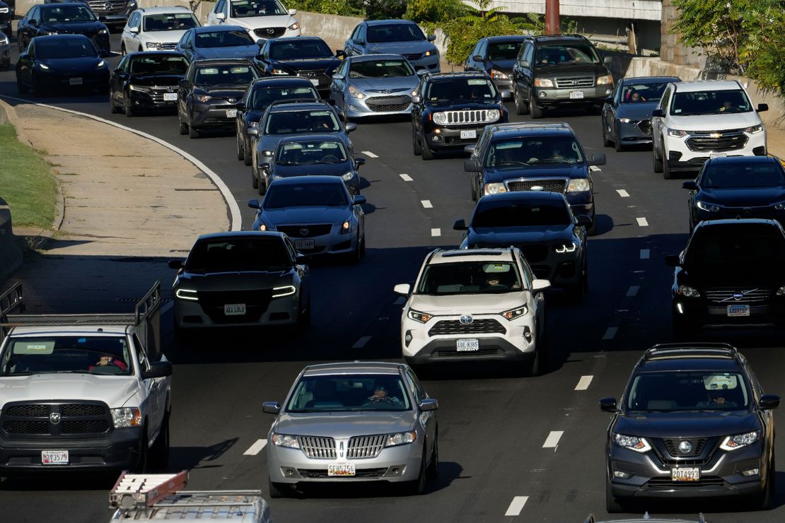 Traffic moves along Interstate 395 in Washington, D.C, for Labor Day weekend 2023. Good news to contemplate if you're stuck in traffic: Average gasoline prices are lower for Labor Day 2024.