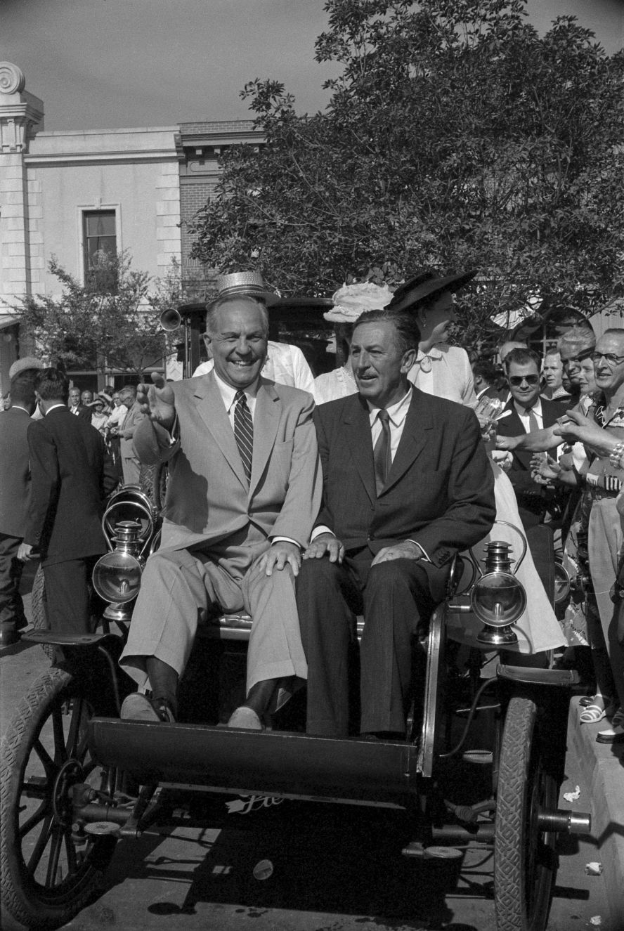 California Gov. Goodwin Knight, left, and Walt Disney ride in a parade on the park's opening day.