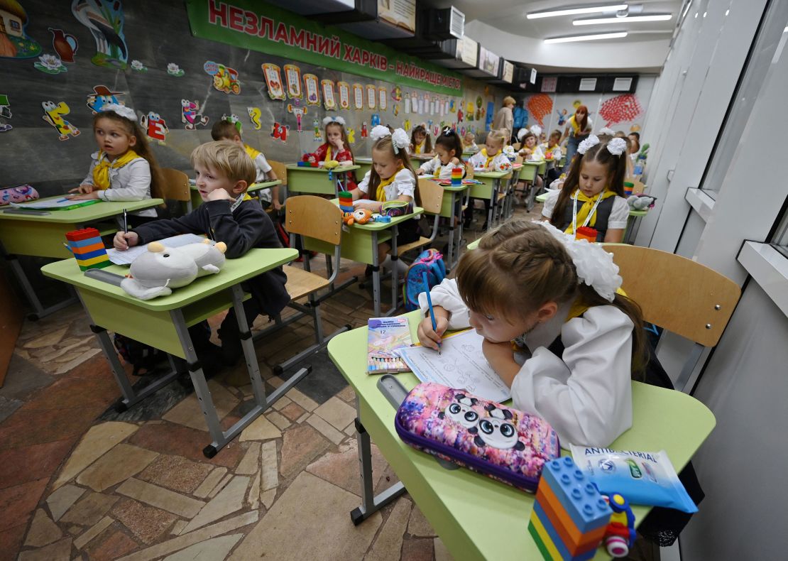 Pupils of the first grade attend a lesson in a classroom set up in a subway station in Kharkiv.