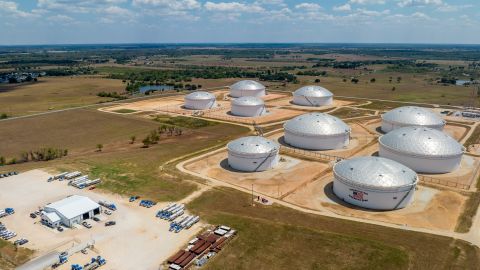 In an aerial view, oil storage tanks at the Enterprise Sealy Station are seen on August 28, 2023 in Sealy, Texas.