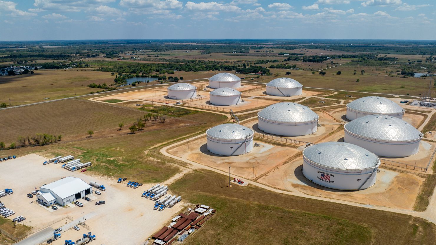 In an aerial view, oil storage tanks at the Enterprise Sealy Station are seen on August 28, 2023 in Sealy, Texas.