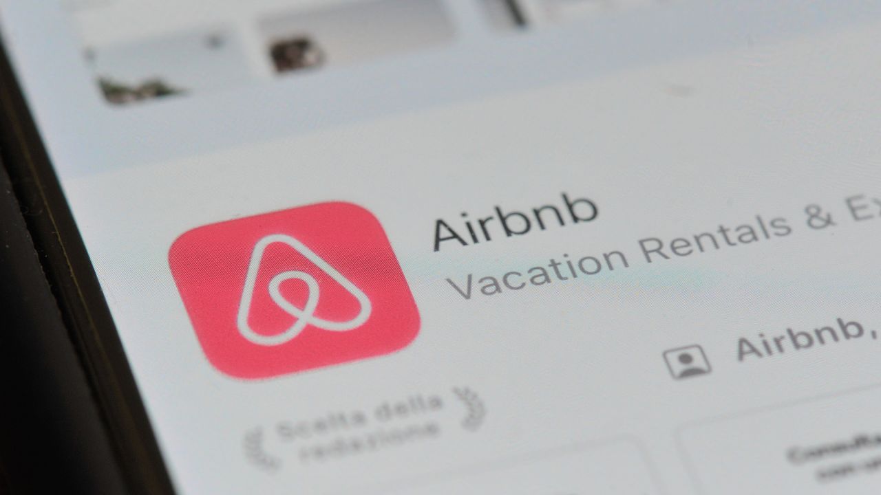 An Airbnb logo displayed on a smartphonein September 2023.
