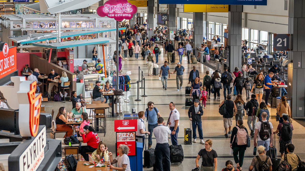 AUSTIN, TEXAS - AUGUST 31: People travel through the Austin-Bergstrom International Airport on August 31, 2023 in Austin, Texas. The FAA has projected Thursday to be the busiest day in U.S. airspace with over 50,000 flights scheduled ahead of the Labor Day weekend. (Photo by Brandon Bell/Getty Images)