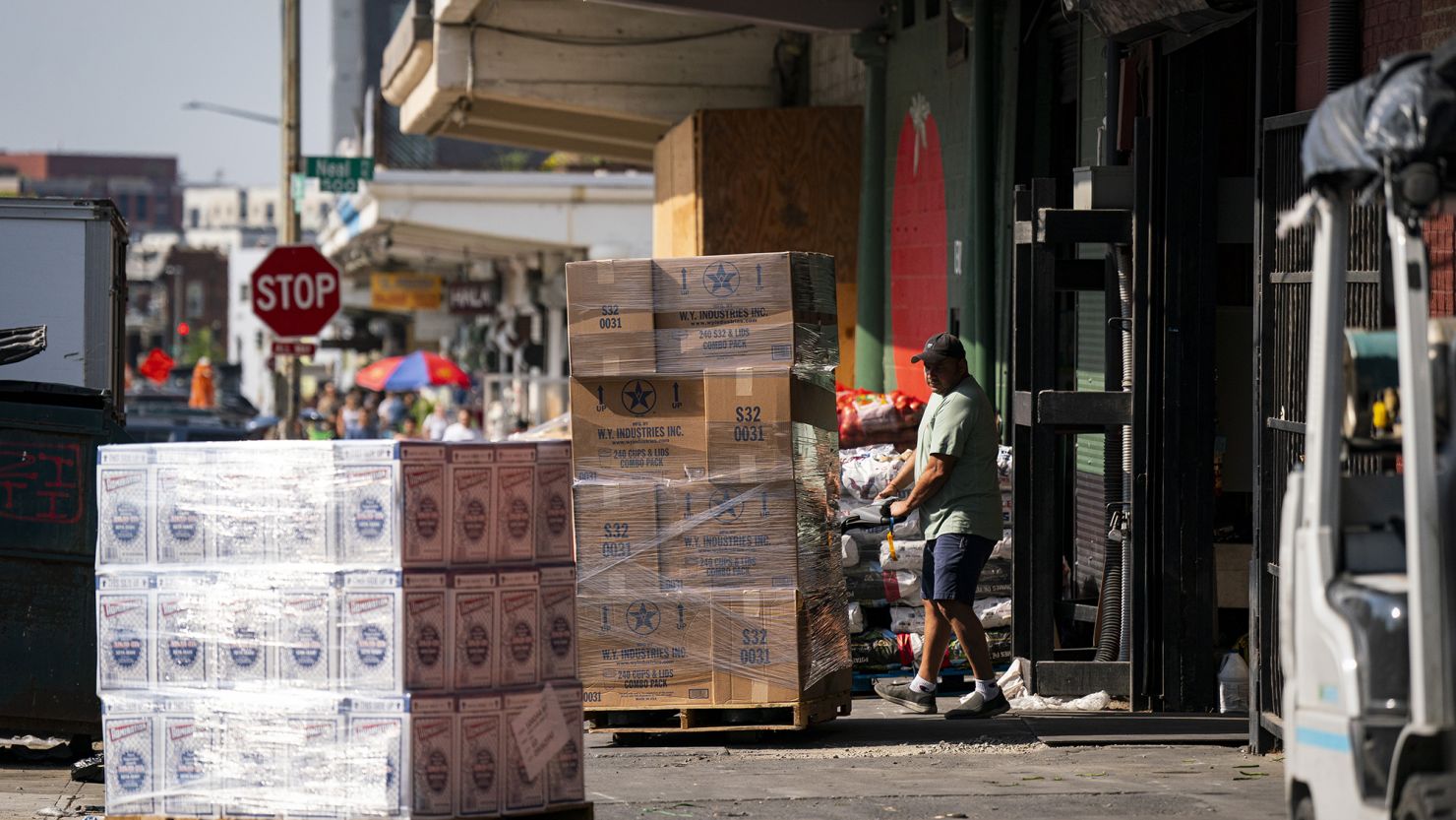 A worker wheels a pallet at a wholesale produce market in the Union Market district in Washington, DC, on Friday, Sept. 8, 2023.