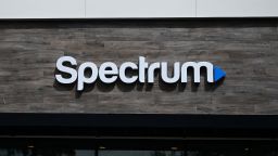 The Spectrum logo is displayed outside one of the company's stores in Manhattan Beach, California, in 2023.