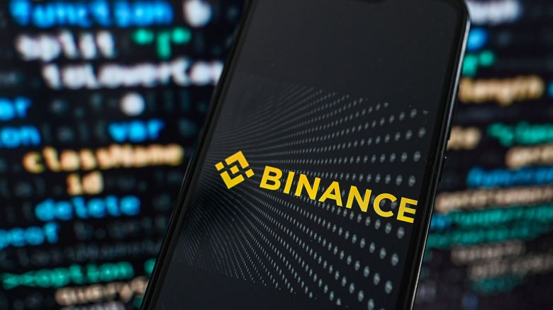 KRAKOW, POLAND - 2023/09/12: In this photo illustration a Binance logo displayed on a smartphone with programing code on the background. (Photo Illustration by Omar Marques/SOPA Images/LightRocket via Getty Images)