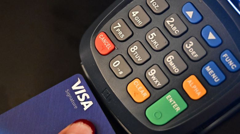 A credit card is placed into a credit card machine for processing payments on September 11, 2023 in La Puente, California. Credit card debt from US consumers is rising by billions of dollars amid higher inflation and interest rates, topping $1 trillion for the first time in history, according to the Federal Reserve Bank of New York. (Photo by Frederic J. BROWN / AFP) (Photo by FREDERIC J. BROWN/AFP via Getty Images)