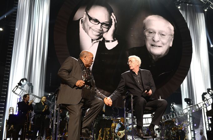 Jones and Michael Caine greet each other onstage in Las Vegas during a gala celebrating their 80th birthdays in 2013.