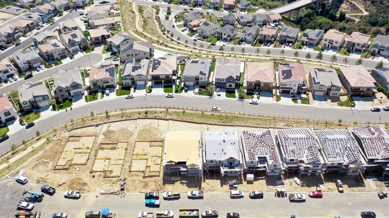 LOS ANGELES, CALIFORNIA - SEPTEMBER 08: An aerial view of existing homes near new homes under construction (BOTTOM) in the Chatsworth neighborhood on September 08, 2023 in Los Angeles, California. According to the National Association of Realtors, the median existing home sale price in the U.S. increased 1.9 percent in July following five straight months of declines, which was the longest stretch of declines in 11 years, amid high-interest rates. (Photo by Mario Tama/Getty Images)