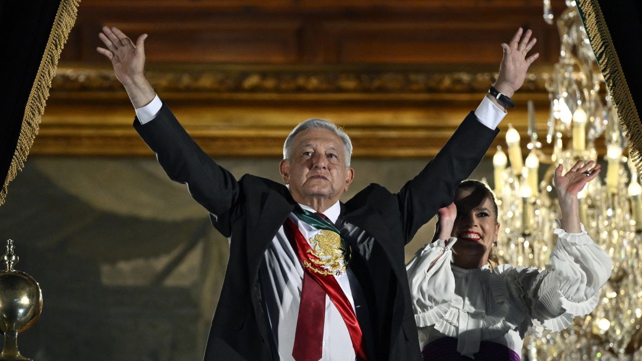 Mexico's President Andres Manuel Lopez Obrador and his wife Beatriz Gutierrez gesture during "The Shout" (El Grito) ceremony marking the start of Independence Day celebrations from the main balcony of the National Palace in Mexico City on September 15, 2023. (Photo by ALFREDO ESTRELLA / AFP) (Photo by ALFREDO ESTRELLA/AFP via Getty Images)