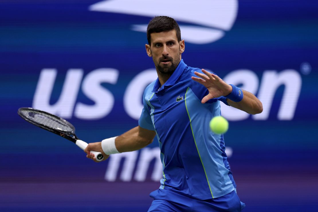 Novak Djokovic returns a shot against Daniil Medvedev at the US Open's men's final in 2023. They both are signed by Lacoste.
