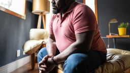 Sad mature man contemplating at home