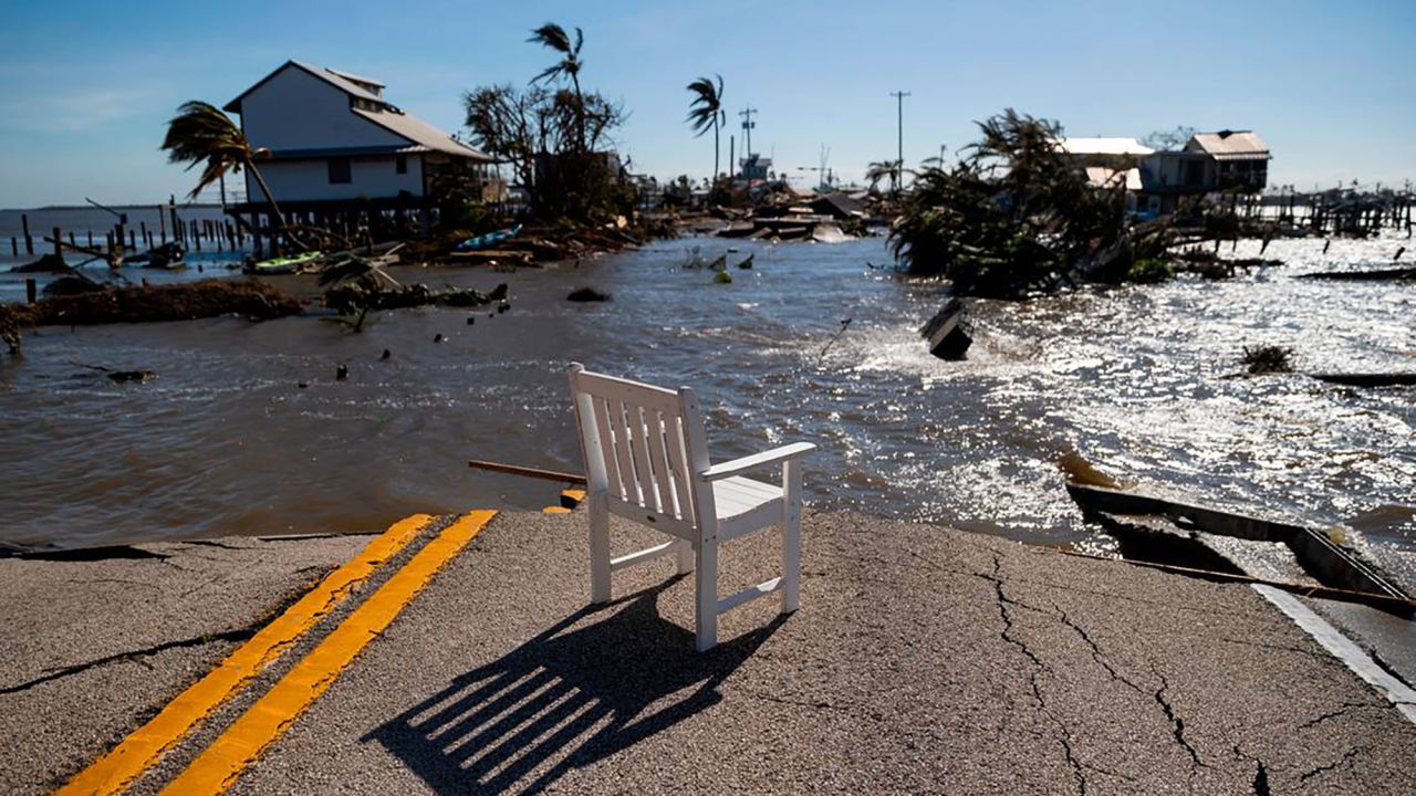 Gulf water flows through a broken section of Pine Island Road on Sept. 29, 2022, in Matlacha, Florida, after Hurricane Ian made landfall as a Category 4 storm, leaving areas affected with flooded streets, downed trees and scattered debris. (Matias J. Ocner/Miami Herald/Tribune News Service via Getty Images)