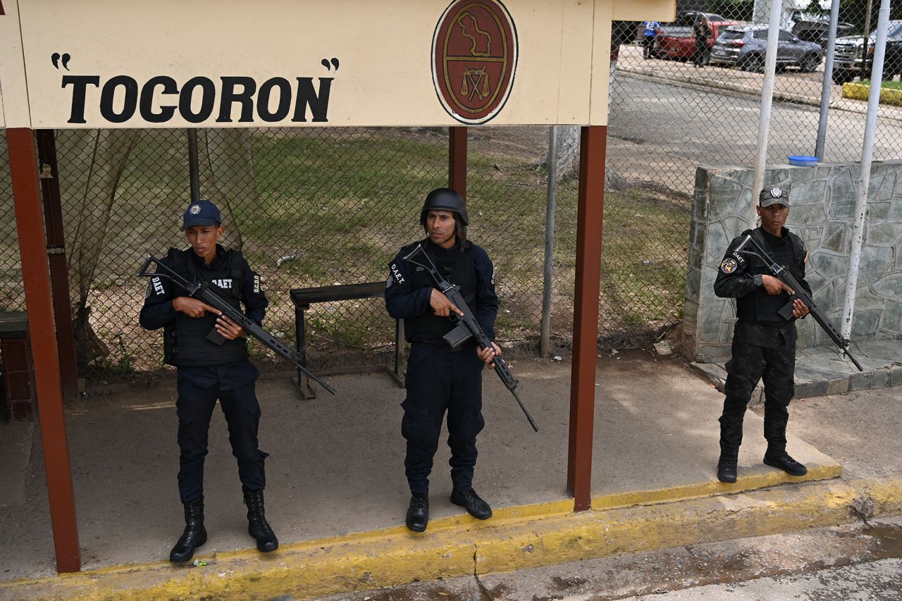 Members of the Bolivarian National Police stand guard in the Tocoron prison, where the Tren de Aragua gang originated, in Tocoron, Venezuela, in September 2023.