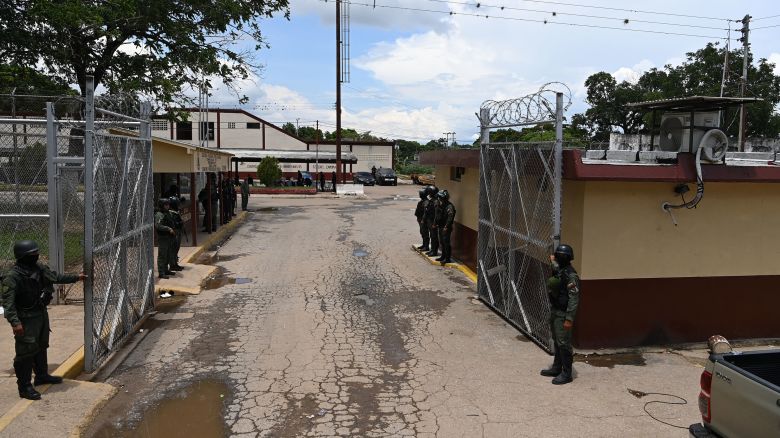 A view of a gate of the Tocoron prison in Tocoron, Aragua State, Venezuela, taken on September 23, 2023. Gang leaders who ruled a prison in Venezuela that was stormed by more than 11,000 soldiers and police had fled the country a week before the operation, a prisoners' rights group said Friday.The bosses of the Tren de Aragua gang, which used Tocoron prison as a base for their international crime operations, escaped after apparently being tipped off about the huge operation, which had been planned for a year. On Wednesday, a vast force of security personnel, backed by armored vehicles, took back control of the notorious penitentiary that had been run by the inmates. (Photo by YURI CORTEZ / AFP) (Photo by YURI CORTEZ/AFP via Getty Images)
