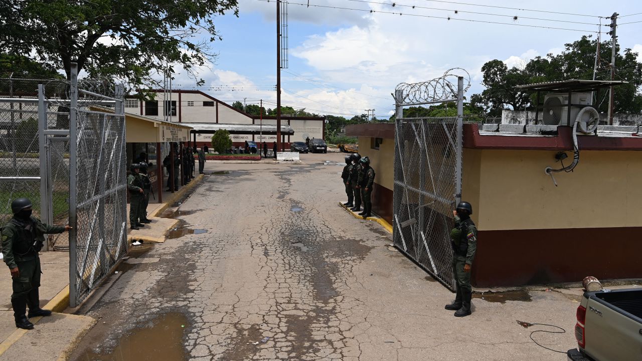 A view of a gate of the Tocoron prison in Tocoron, Aragua State, Venezuela, taken on September 23, 2023. Gang leaders who ruled a prison in Venezuela that was stormed by more than 11,000 soldiers and police had fled the country a week before the operation, a prisoners' rights group said Friday.The bosses of the Tren de Aragua gang, which used Tocoron prison as a base for their international crime operations, escaped after apparently being tipped off about the huge operation, which had been planned for a year. On Wednesday, a vast force of security personnel, backed by armored vehicles, took back control of the notorious penitentiary that had been run by the inmates. (Photo by YURI CORTEZ / AFP) (Photo by YURI CORTEZ/AFP via Getty Images)