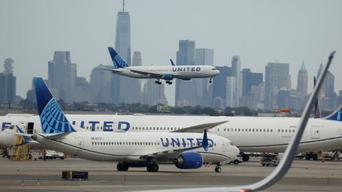 NEWARK, NEW JERSEY - SEPTEMBER 17: A United Airlines plane lands at Newark Liberty International Airport in front of the New York skyline on September 17, 2023 in Newark, New Jersey. (Photo by Justin Sullivan/Getty Images)