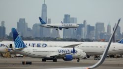 NEWARK, NEW JERSEY - SEPTEMBER 17: A United Airlines plane lands at Newark Liberty International Airport in front of the New York skyline on September 17, 2023 in Newark, New Jersey. (Photo by Justin Sullivan/Getty Images)