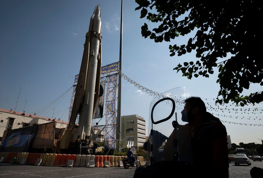 Motorcyclists will observe ballistic missiles burning solid fuel from Iranian Sedil on display in a square in southern Tehran at the military exhibition on September 26, 2023.