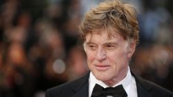 US actor and director Robert Redford poses on May 22, 2013 as he arrives for the screening of the film "All is Lost" presented Out of Competition at the 66th edition of the Cannes Film Festival in Cannes. Cannes, one of the world's top film festivals, opened on May 15 and will climax on May 26 with awards selected by a jury headed this year by Hollywood legend Steven Spielberg.        AFP PHOTO / VALERY HACHE (Photo by Valery HACHE / AFP) (Photo by VALERY HACHE/AFP via Getty Images)