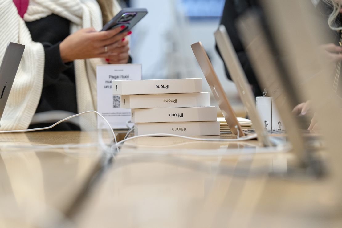 A customer purchases the new iPhone 15 in store on September 22, 2023 in Milan, Italy.