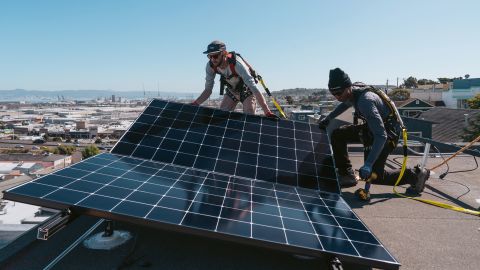 Workers install solar panels during a Luminalt installation at a home in San Francisco, California, US, on Wednesday, Sept. 27, 2023. A record 7.2 gigawatts of new residential solar installations are expected to come online in the US this year, according to BloombergNEF, up from 6.7 gigawatts in 2022.Â Photographer: Michaela Vatcheva/Bloomberg via Getty Images