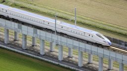 Photo taken from a Kyodo News helicopter shows a Hokuriku Shinkansen bullet train making a trial run in Kaga, Ishikawa Prefecture, central Japan, on Oct. 1, 2023, ahead of a new section opening. (Photo by Kyodo News via Getty Images)