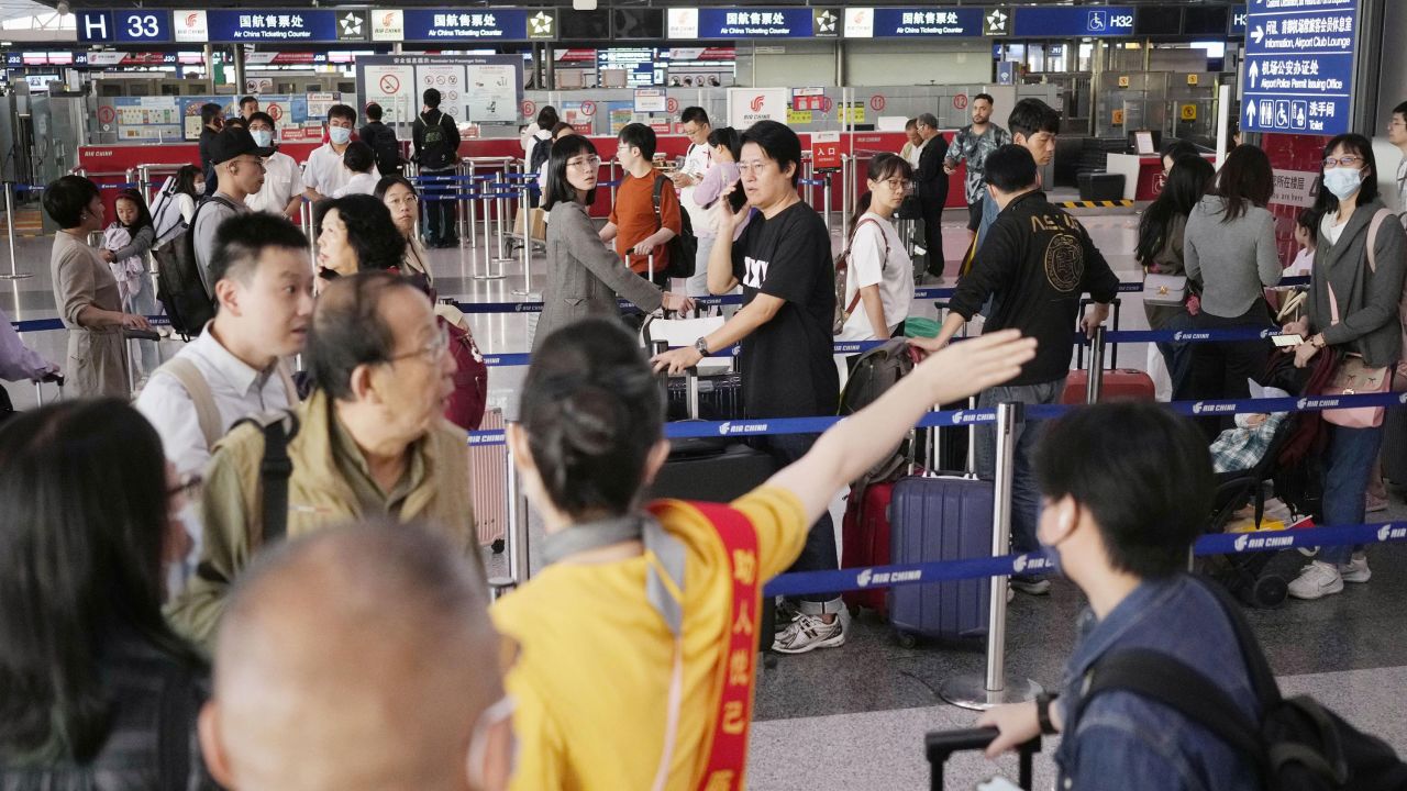A Beijing Capital International Airport departure lobby is crowded with people flying out of the Chinese capital on Sept. 29, 2023, ahead of National Day on Oct. 1 marking the 74th anniversary of the founding of the People's Republic of China. (Photo by Kyodo News via Getty Images)