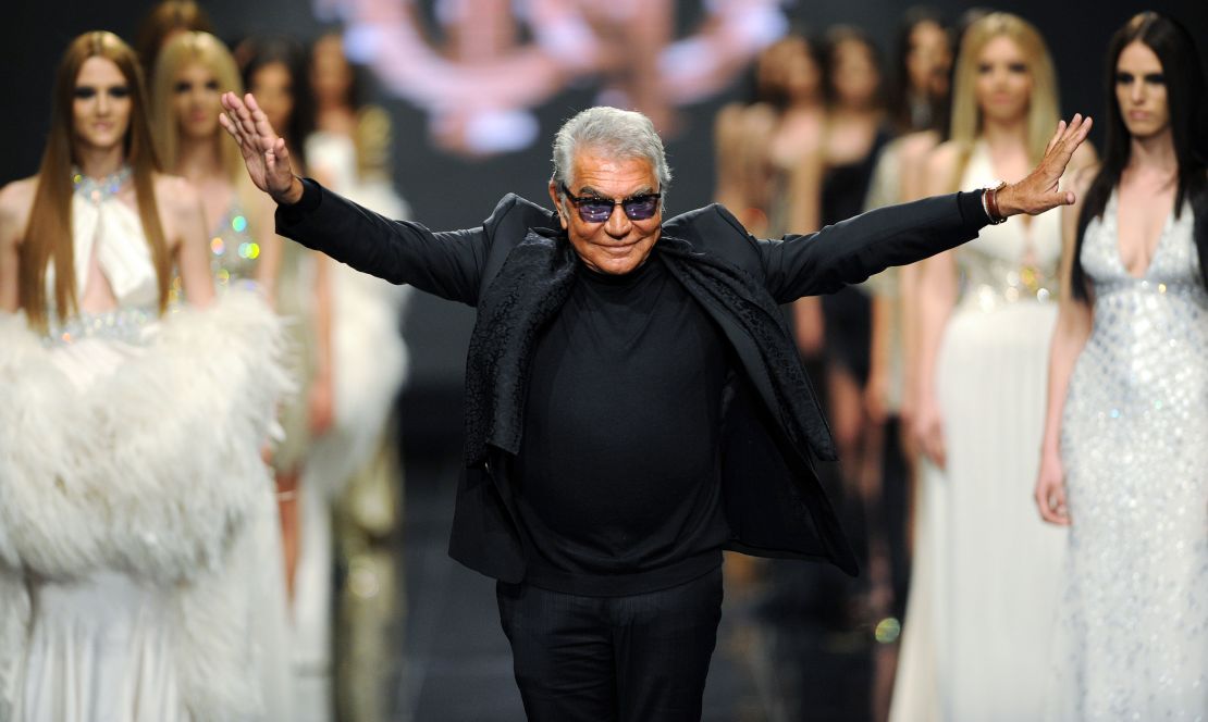 Roberto Cavalli walks the runway after a fashion show showcasing his label's designs in Budva, Montenegro on June 10, 2013.
