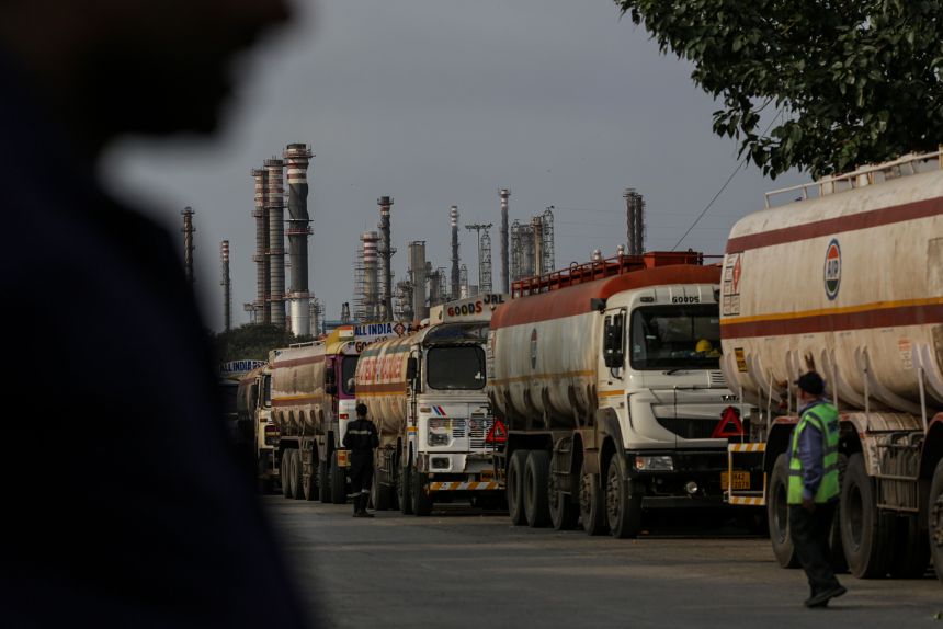 Oil tanker trucks outside an oil refinery operated by Bharat Petroleum Corp. Ltd., in Mumbai, India.