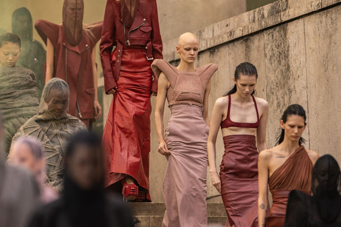 Rick Owens' show was inspired by optimism, and this season he dissented from his often monochromatic taste to unveil a vibrant color palette of dusty roses and reds.